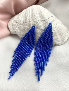 Hand-stitched bright blue earrings made with 100% Czech glass beads. Shining beaded earrings make an excellent personalized gift for bridesmaids, birthdays, Valentine's Day, Wedding day, Christmas, New Year, and others. ♡ Bead Length - 3.5'' (9 Centimeters) ♡ Total Length - 3.9'' (10 Centimeters) ♡ Width - 0.8'' (2.5 Centimeters) ♡ Quality Czech beads ♡ Stainless steel mounts If you like these dangle fringe earrings but would like them in a different color or size please email me and I do a spec Blue Beaded Earrings, Gift For Bridesmaids, Earrings Chandelier, Emerald Bead, Handmade Earrings Beaded, Earrings Bridesmaid, Yellow Earrings, Seed Bead Earrings, Seed Bead Jewelry