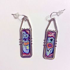 These 2” Long Silver Tone Earrings Feature Swirling Colors Of Blue, Orange, Purple And Green. Artsy Multicolor Rectangular Earrings, Nickel-free Multicolor Rectangular Earrings, Nickel-free Multicolor Artsy Earrings, Artsy Multicolor Nickel-free Earrings, Artsy Multicolor Nickel Free Earrings, Halloween Earrings Beaded, Taco Earrings, Colors Of Blue, Rectangular Earrings