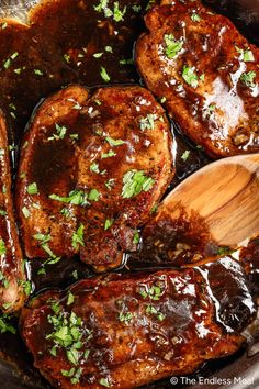 meat covered in sauce and garnished with parsley