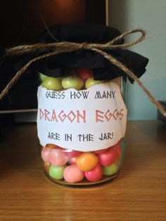 a jar filled with candy sitting on top of a wooden table