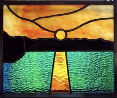 a stained glass window sitting on top of a table