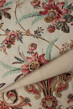 two different types of fabric with flowers and leaves on the same color as they appear in this photo