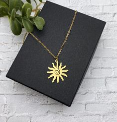 "This is a beautiful shiny gold stainless steel modern sun necklace. This necklace is all stainless steel - chain, charm, lobster clasp and jump rings.  This necklace is the same on both sides and perfect to wear all the time.   The modern sun charm measures 1 inches in diameter. I also have this necklace in natural silver stainless steel: https://www.etsy.com/listing/1069641156/stainless-steel-sun-necklace-on-a?click_key=675dc499c5d80b2a229754eada1cd891d8534512%3A1069641156&click_sum=fdd1aae1&g Metal Sun Design Necklace As Gift, Trendy Gold Jewelry With Sun Design, Gold Sun Design Necklace In Metal, Minimalist Gold Necklace With Sun Design, Minimalist Sun Design Necklace As Gift, Sun Minimalist, Hypoallergenic Necklace, Sun Charm, Sun Necklace