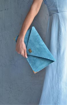 Soft Symmetria Clutch in jeans blue.The perfect bag for all occasions!Ideal for cocktail and parties or for business meetings depending the size you choose. It comes in two sizes, small and large.You can use it as a chic briefcase for your work or as a modern large clutch for a night out.This adorable large clutch is handmade out of a genuine, lux Italian jeans blue suede leather.-Small size fits all your essentials, wallet, keys, mobile, cosmetics etc. -Large size fits a 15" laptop, ipad, porto Blue Envelope Bag For Daily Use, Modern Blue Pouch Clutch, Modern Blue Leather Clutch, Chic Blue Everyday Clutch, Blue Rectangular Clutch For Everyday, Blue Leather Chic Clutch, Blue Chic Leather Clutch, Everyday Blue Rectangular Clutch, Blue Pouch Clutch For Everyday Use