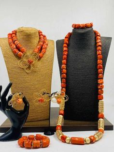 Handcrafted African Coral Beads Necklace - Unique Ethnic Jewelry for a Statement Look NEED OTHER DESIGNS OF BRIDE AND GROOM CORAL BEADS, AFRICAN PRE-TIED HEADWRAPS, BRAIDED WIGS AND AFRICAN GIFT ITEMS, VISIT OUR SHOP HERE: https://sereneafrica.etsy.com/ Materials: 1. Natural/Original African Coral bead 2. Gold color accessories.  3. This listing contains 2 layers of necklace, 2 bracelets, a set of dangling earrings for bride/woman 1 piece of necklace and 1 bracelet for men. PLEASE NOTE THE VARIA Elegant Beaded Necklaces For Traditional Ceremonies, Polished Beads For Weddings, Wedding Beaded Necklace With Gold Round Beads, Traditional Gold Beaded Necklaces For Ceremonies, Traditional Bridal Necklace With Large Beads, Traditional Bridal Necklace With Round Beads For Marriage, Bohemian Beaded Necklaces For Wedding, Bohemian Beaded Necklaces With Round Beads For Wedding, Bohemian Beaded Necklace With Round Beads For Wedding