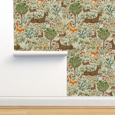 an animal themed wallpaper with deers and trees in the background, on a white wall