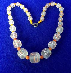 "Vintage 1950s Venetian 'Wedding Cake Beads'  Graduated Glass Bead 14\" Necklace from Murano in Clear Glass with Coral & Cream Piping and Orange Spacers A true delight.  We brought this back from  the Venetian glass making island of Murano.  We discovered this in the back rooms of a glass factory  where it may have lain in the shadows since then  We rescued it and bore it into the bright Adriatic sun. Cylindrical beads with their 'wedding cake icing sugar' striation.  14 inches long, weighing 43 Wedding Cake Icing, Back Rooms, Venetian Wedding, Cake Icing, Cream Silk, Venetian Glass, Antique Jewellery, Hand Beading, Glass Bead