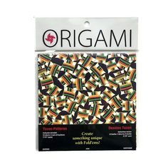 an origami quilt kit with black, yellow and green designs on the front