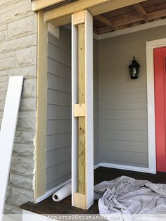 the front porch is being installed and ready to be used as an outdoor storage area