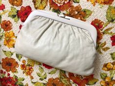 Cream Pouch Clutch For Evening, Chic Cream Clutch For Spring, Cream Leather Evening Bag, Spring Beige Clutch For Formal Occasions, Spring Formal Beige Clutch, Classic Cream Clutch For Everyday Use, Cream Clutch Evening Bag For Formal Occasions, Cream Clutch Evening Bag For Formal Events, Classic Beige Clutch For Daily Use