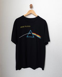 Pink Floyd T Shirt 90s Vintage Dark Side Of The Moon XL 1998 copyright license, tag is missing but could've been an Anvil made in mexico of USA fabric tag or vintage Gildan, Pink Floyd The Dark Side Of The Moon 90s reprint of the 70s album. Item is sold as is. T Shirt has no flaws its in excellent shape. Measurements Chest: 23.85 in Length: 28.75 in Shoulders: 22 in Sleeve Length: 8.75 in Open to offers. Feel free to ask any further questions. All items listed are cleaned and cared for so when y Pink Floyd T Shirt, Etiquette Vintage, Dark Side Of The Moon, Man On The Moon, The Dark Side, Fabric Tags, Pink Floyd, 90s Vintage, Dark Side