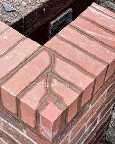 the corner of a brick wall that is being built