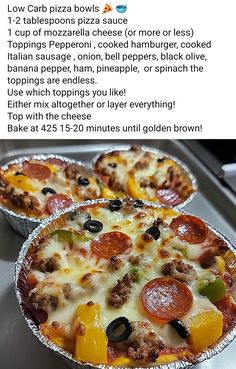 two pizzas sitting in tin foil pans on top of a stove with instructions for how to bake them