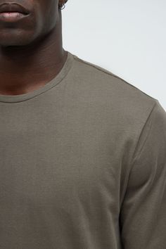 Model Height: 6'2 - Wearing Large Big & Tall: Height 6'3- Wearing XXXL Available In Black, Burgundy, Grey, Navy, Olive And White T-Shirt Crew Neck Long Sleeve 100% Cotton Imported | Mens Essential Long Sleeve Scallop Tee Shirt in Olive Green size Small by Fashion Nova Tall Height, Olive Fashion, Mens Essentials, Big & Tall, White T Shirt, White Tshirt, Model Height, Mens Tees, Olive Green