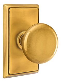 a gold door handle with a round knob