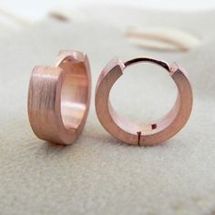 Rose gold plated huggie hoop earrings for men. These hoop earrings are size M. Made from sterling silver and plated in rose gold with a brushed matte finish. SPECIFICATION Base metal: Recyclable fine 925 Sterling Silver Outer layer: 18K rose gold, matte finish Outer Diameter: 12mm (medium hoop size) Inner Diameter: 8mm Ear Post: 20 gauge. We can customize the guage in 14, 16, and 18G for an additional fee. Shop policy https://www.etsy.com/your/shops/360JewelsElite/policies Learn more about our 1 Rose Gold Huggie Hoop Earrings For Anniversary, Modern Small Hoop Huggie Earrings In Rose Gold, Anniversary Rose Gold Small Hoop Huggie Earrings, Anniversary Small Hoop Rose Gold Huggie Earrings, Modern Rose Gold Hoop Earrings For Gift, Modern Hypoallergenic Rose Gold Huggie Earrings, Rose Gold Small Hoop Huggie Earrings, Rose Gold Hypoallergenic Hoop Earrings For Anniversary, Tarnish Resistant Rose Gold Huggie Hoop Earrings