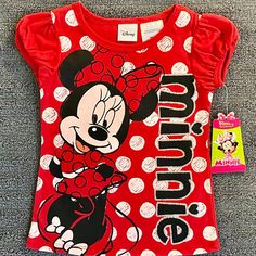 Dress Your Little Girl In Style With This Adorable Minnie Mouse Fashion T-Shirt. The Shirt Features The Iconic Disney Character In A Vibrant Red Color, Perfect For Any Occasion. The Shirt Is Made For Girls In Size 2t And Is Brand New. It Is A Perfect Addition To Any Disney Fan's Collection. The Shirt Is Made With High-Quality Materials And Is Sure To Be Comfortable For Your Little One All Day Long. Its Cute Design And Vibrant Colors Make It A Great Gift For Any Occasion. Don't Miss Out On The Ch Playful Red Mickey Mouse Top, Cotton Minnie Mouse Top For Playtime, Playful Mickey Mouse Tops For Playtime, Casual Minnie Mouse Tops For Playtime, Cotton Mickey Mouse Top For Playtime, Playful Minnie Mouse Short Sleeve Top, Cute Minnie Mouse Cotton Top, Red Character Print T-shirt For Playtime, Red Crew Neck Top With Minnie Mouse Detail