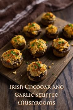 small stuffed mushrooms on a wooden board with the words irish cheddar and garlic scuffo mushrooms