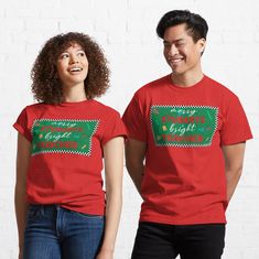 two people wearing red christmas t - shirts with green trees on the front and bottom