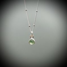 Dainty Green Aventurine Crystal and sterling silver pendant on a sterling silver satellite chain.  A beautifully polished Aventurine crystal encased in sterling silver.  Your choice of either a 14, 16 or 18 inch satellite chain. All of our jewellery comes beautifully gift boxed and bagged along with a description of your crystal's benefits. Our jewellery also makes an amazing gift. We are happy to ship this direct for you with a personal message on one of our handprinted cards.  Just let us know Silver Aventurine Jewelry As A Gift, Silver Crystal Necklace For May Birthstone, Silver Crystal Necklace For May Birthstone Gift, Everyday Silver Birthstone Necklace With Gemstone, Silver Pendant Crystal Necklace For May Birthstone, Silver Pendant Birthstone Necklace With Natural Stones, Silver Birthstone Pendant Necklace With Natural Stones, Silver Charm Necklace With Round Natural Stone Pendant, Minimalist Silver Charm Necklace With Emerald