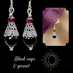 Black onyx and Garnet silver Bohemian dangle earrings. You will love these gemstone beauties! The bead caps are hand cast silver with a beautifully intricate design. The stones are faceted black onyx and Garnet. The French earwires are sterling silver. These earrings are 1 1/2 inches long and a half inch wide. All my jewelry comes gift boxed with a custom Shelly Mariposa Design butterfly card ready for gift giving, whether it is a gift for you or someone special. Your satisfaction is very import Traditional Onyx Jewelry As A Gift, Elegant Silver Beaded Earrings For Gift, Teardrop Silver Beads Jewelry Gift, Teardrop Silver Beads Jewelry As Gift, Traditional Silver Crystal Earrings As Gift, Onyx Dangle Jewelry As Gift, Traditional Onyx Jewelry Gift, Onyx Drop Earrings As A Gift, Black Earrings With Silver Beads As Gift