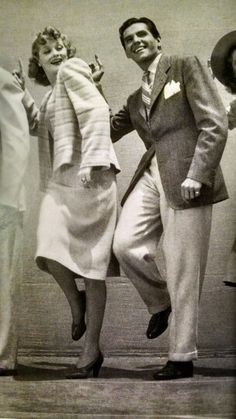 an old black and white photo of three people dancing