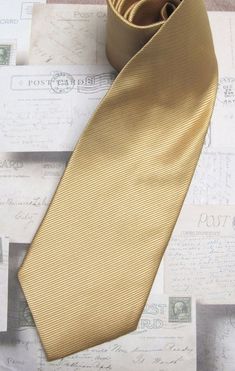 This tie is made of 100% silk, 3.50" wide at it's widest point and 58" long - standard length and width. Hand rolled and sewn by hand. Classic Silk Ties For Office, Classic Gold Tie For Formal Occasions, Classic Gold Tie And Suit Accessories, Gold Standard Tie For Business, Fitted Gold Tie For Semi-formal Occasions, Silk Tie For Black Tie Events, Silk Standard Tie For Black Tie Events, Classic Gold Tie For Business, Formal Fitted Gold Neckwear