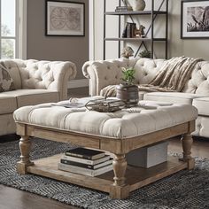 a living room filled with furniture and a coffee table on top of a rug covered floor