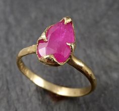 I created this setting in wax then cast it in recycled solid 18k Yellow gold at my home studio. This ring is a size 7 it can be sized. The stone is a Burma Ruby. it measures about 10mm X 6mm I created a rustic texture in the gold. Throughout all time and history, in every tribe and culture all around the world crystals, minerals and gemstones have used for healing, luck, divination, adornment vibrational medicine and so much more. Ruby encourages passion and a zest for life. It improves motivati Rough Gemstone Jewelry, Vibrational Medicine, Rustic Texture, Garnet And Gold, Minerals And Gemstones, Watermelon Tourmaline, Rough Gemstone, Yellow Gold Ring, Ring Gemstone