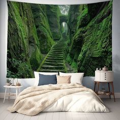 a bed room with a large green wall mural on the wall and stairs leading up to it