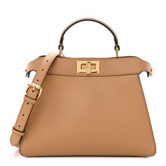 This is an authentic FENDI Vitello Seta Nappa Bi-Color Small Peekaboo I SEE U Satchel in Miele Scuro, Light Rose, Ghianda. This stylish small tote is crafted of soft lambskin leather. The crossbody bag features a looping top handle, an optional, adjustable shoulder strap, and polished gold hardware including Fendi logo turn locks on either side. These open to a partitioned beige leather interior with zipper and patch pockets. Fendi Logo, Light Rose, Rose Lights, Small Tote, Lambskin Leather, Leather Interior, Gold Hardware, Patch Pocket, Top Handle