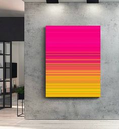 an abstract painting is displayed on the wall