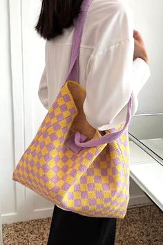 Experience the charm and practicality of the Ms Checked Out Lately Crochet Tote Bag in LAVENDER! This beautifully crafted tote bag is the perfect accessory for any modern, fashion-forward individual. Stay stylish and organized with its spacious interior and trendy checkered design. A must-have for anyone on the go, this tote bag will effortlessly elevate your outfit and add a touch of elegance to your everyday look. Don't miss out on this versatile and timeless piece! -CHECKERED CROCHET COMMUTER Bill Of Lading, Craft Tote, Knitting Tote Bag, Checkered Design, Clothing Boxes, Stylish Tote Bag, Craft Tote Bag, Commuter Bag, Crochet Tote Bag