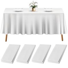 a table with four place mats and a potted plant next to it on top