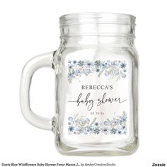 a glass jar with flowers on the side and a white lid that says mr and mrs