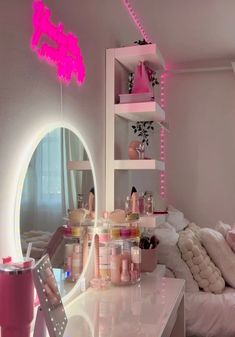 a room with a mirror, lights and various items on the table in front of it