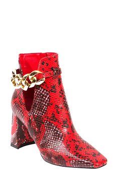 A flared block heel elevates this square-toe ankle bootie with a chain-accented side cutout for added glam. 3" heel 5" shaft; 10" calf circumference Synthetic upper, lining and sole Imported Bold Block Heel Party Boots, Bold Party Boots With Block Heel, Chain Boots For Fall Party, Chain Boots For Party In Fall, Snake Print Boots, Red Snake, Crystal Belt, Chunky Block Heels, Ankle Bootie