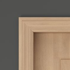 an open wooden door on a gray wall