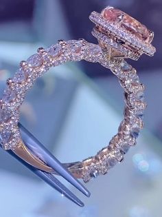 a close up of a diamond ring on display