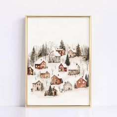 a painting of houses in the snow on a white wall next to a gold frame