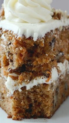 a piece of carrot cake with white frosting