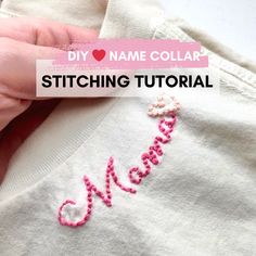 someone is stitching their name on the back of a t - shirt with pink thread