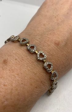 Vintage Diamond Heart Bracelet Golden 925 Sterling Silver https://www.etsy.com/listing/1201659123/vintage-diamond-heart-bracelet-golden?utm_source=crowdfire&utm_medium=api&utm_campaign=api Sterling Silver Bracelet For Anniversary, Fine Jewelry Sterling Silver Diamond Cut Bracelet For Anniversary, Sterling Silver Bracelet For Valentine's Anniversary, Anniversary Sterling Silver White Gold Tennis Bracelet, Sterling Silver Bracelet With Diamond Accents For Gift, Silver Tennis Bracelet With Diamond Accents As Gift, Silver Heart Cut Bracelets For Valentine's Day, Silver Bracelets For Valentine's Day Formal Occasion, Silver Bracelets For Valentine's Day Formal Event