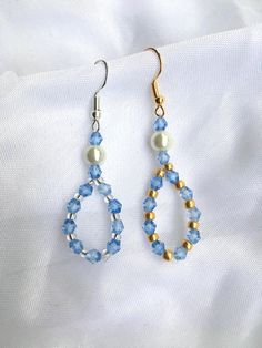 These gorgeous crystal bead  earrings are handmade in Hertfordshire England and are the perfect accessory with any fall outfit.  The earrings will arrive packaged in a beautiful white organza bag, ready for gifting.  These earrings are part of the ourLADYLIKE collection which takes inspiration from different Marian apparitions. These earrings represent Our Ladys blue and white apparition at the French town of Lourdes, where she revealed herself as the Immaculata. Blue Round Bead Crystal Earrings For Gifts, Blue Crystal Round Bead Earrings For Gift, Blue Round Beads Crystal Earrings For Gift, Elegant Blue Crystal Earrings With Faceted Beads, Blue Crystal Earrings With Faceted Beads As Gift, Light Blue Crystal Earrings For Gift, Elegant Light Blue Beaded Earrings As Gift, Crystal Beaded Earrings As Gift, Crystal Beaded Earrings With Round Beads As Gift