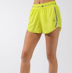 The Ultra-Lightweight Shorts Feature An Elasticated Mesh Waistband For Comfort And Coverage And Have A Loose Fit Around The Legs To Minimize Distractions As You Put In Your Miles. Breathable Mesh Inserts Make Them The Ideal Choice For Almost All Workoutsfrom Hot Yoga And Hiit To Your Next Spin Class. Regular Fit Elastic Waist 60% Recycled Polyester, 40% Polyester Dobby Ultra Lightweight Fabric Running Shorts Bonded Seams For Comfort Mesh Inserts For Breathability Adidas By Stella Mccartney Logo Spring Running Bottoms With Elastic Waistband, Yellow Bottoms For Summer Running, Sporty Spring Shorts With Waistband, Green Running Shorts For Spring, Green Short Running Bottoms, Green Running Shorts, Yellow Athletic Shorts With Elastic Waistband, Yellow Running Shorts, Yellow Short Activewear