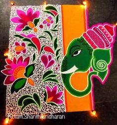 an intricately decorated ganeshi card with lights