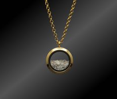 "This unisex customizable cremation ash locket is new to our collection of fill-at-home cremation pieces. Your purchase includes the gold toned locket, gold toned chain, and opal color of your choice and does not require mailing the ashes. It is composed of sturdy glass and gold-toned stainless steel (hypoallergenic, scratch/tarnish resistant). The stainless steel chain is 32\" and can easily be worn shorter by threading the clasp through a different link. If screwed properly, the locket is air Gold Cremation Necklace, Memorial Ashes Jewelry, Necklaces For Ashes, Locket Gold, Memorial Jewelry Ashes, Cremation Necklaces, Urn Necklace, Ashes Jewelry, Cremation Ashes