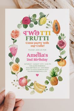 a hand holding up a card with fruit on it and the words two tii frutti come party with