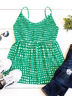 Cute, simple, and stylish... need we say more. The smocked top, beautiful pattern, and soft fabric make this tank stand out in a crowd. Note: Smocking is only on the front of the tank. The back is solid. Size Small 0-4 Medium 6-8 Large 10-12 XL 12-14 Sleeveless Polka Dot Tops For Vacation, Casual Polka Dot Tank Top, Chic Polka Dot Tank Top For Summer, Sleeveless Polka Dot Top For Beach, Summer Vacation Tank Top With Smocked Bodice, Summer Tank Top With Smocked Bodice For Day Out, Sleeveless Smocked Back Tank Top For Vacation, Spring Sleeveless Tank Top With Smocked Back, Sleeveless Tank Top With Smocked Back For Vacation