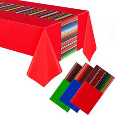 a red table cloth with different colors on it